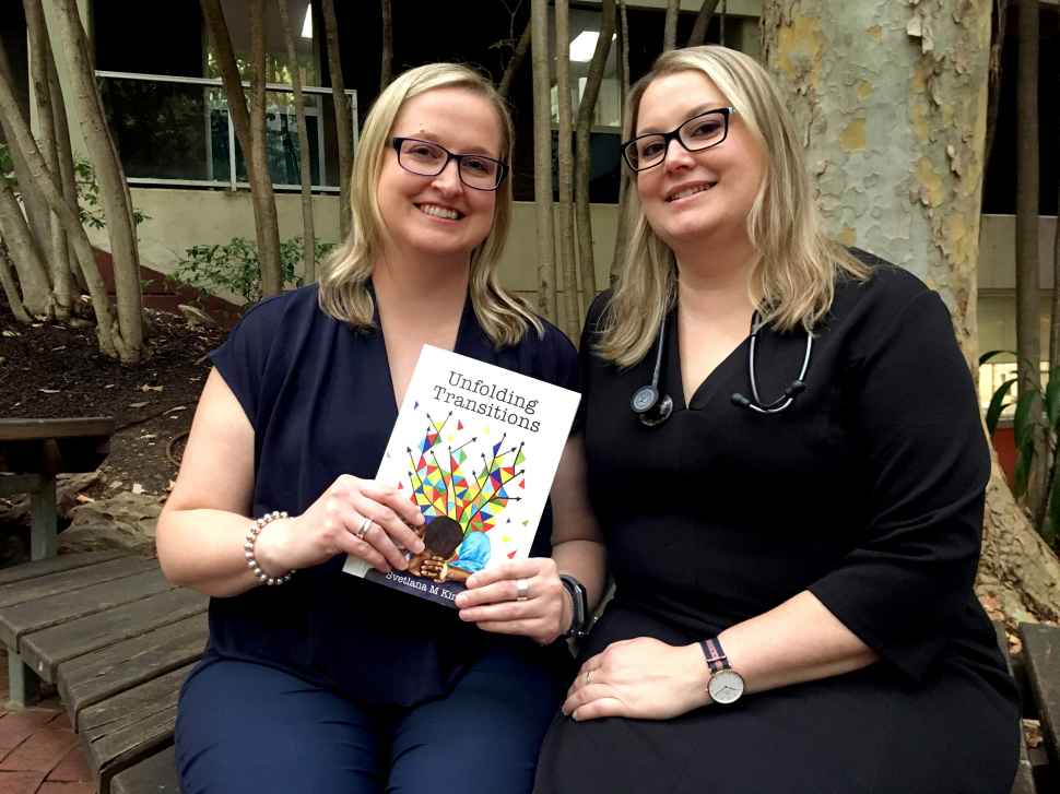 Svetlana and Jovanka King holding their book, 'Unfolding Transitions'