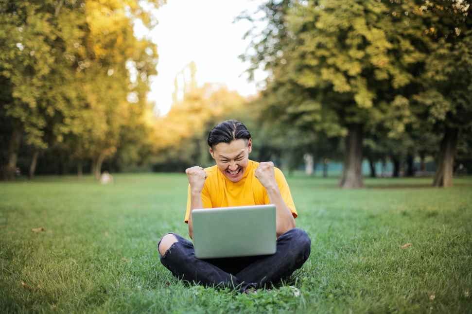 man-yellow-shirt-laptop