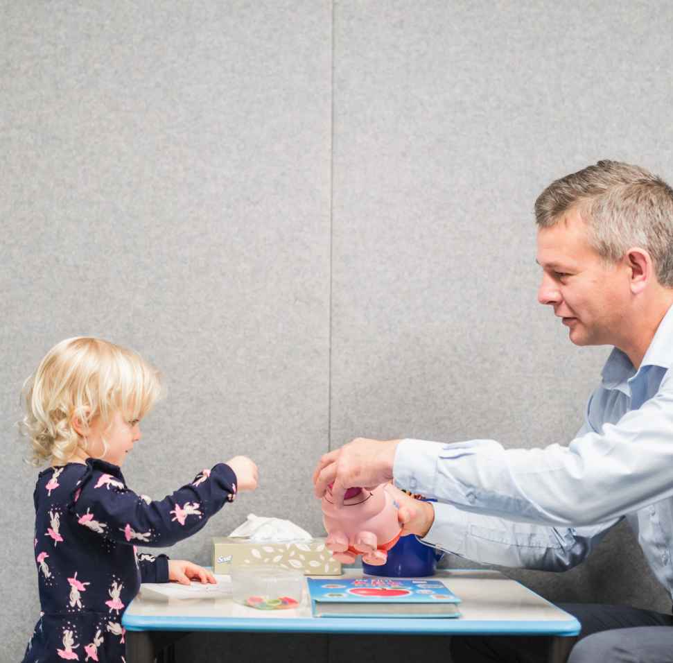 Flinders Speech Pathologist with young girl playing with toys