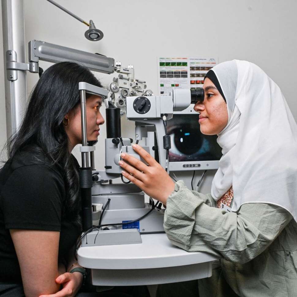 Flinders Optometry Student running eye test with patient