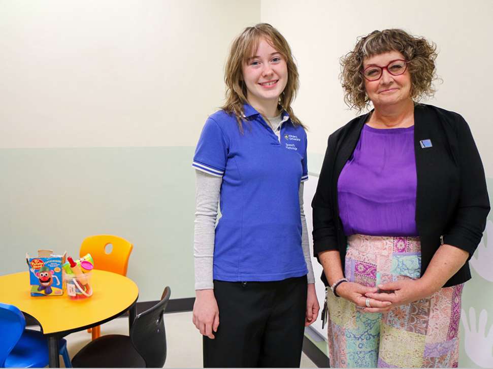 Flinders Speech Pathology Student smiling with Clinician stood next to her
