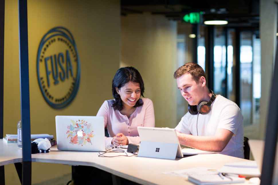 Students studying together in the Hub